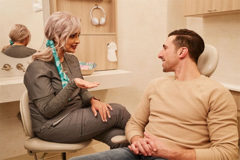 Dentist consulting with patient at ClearSmile